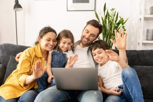 family-smiles-at-computer